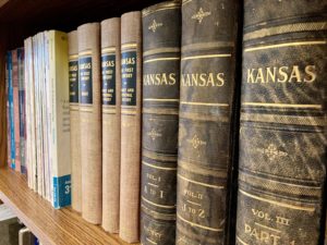 A shelf of history books on Kansas